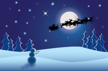 Babbo Natale in volo con la sua slitta e le fedeli renne. 